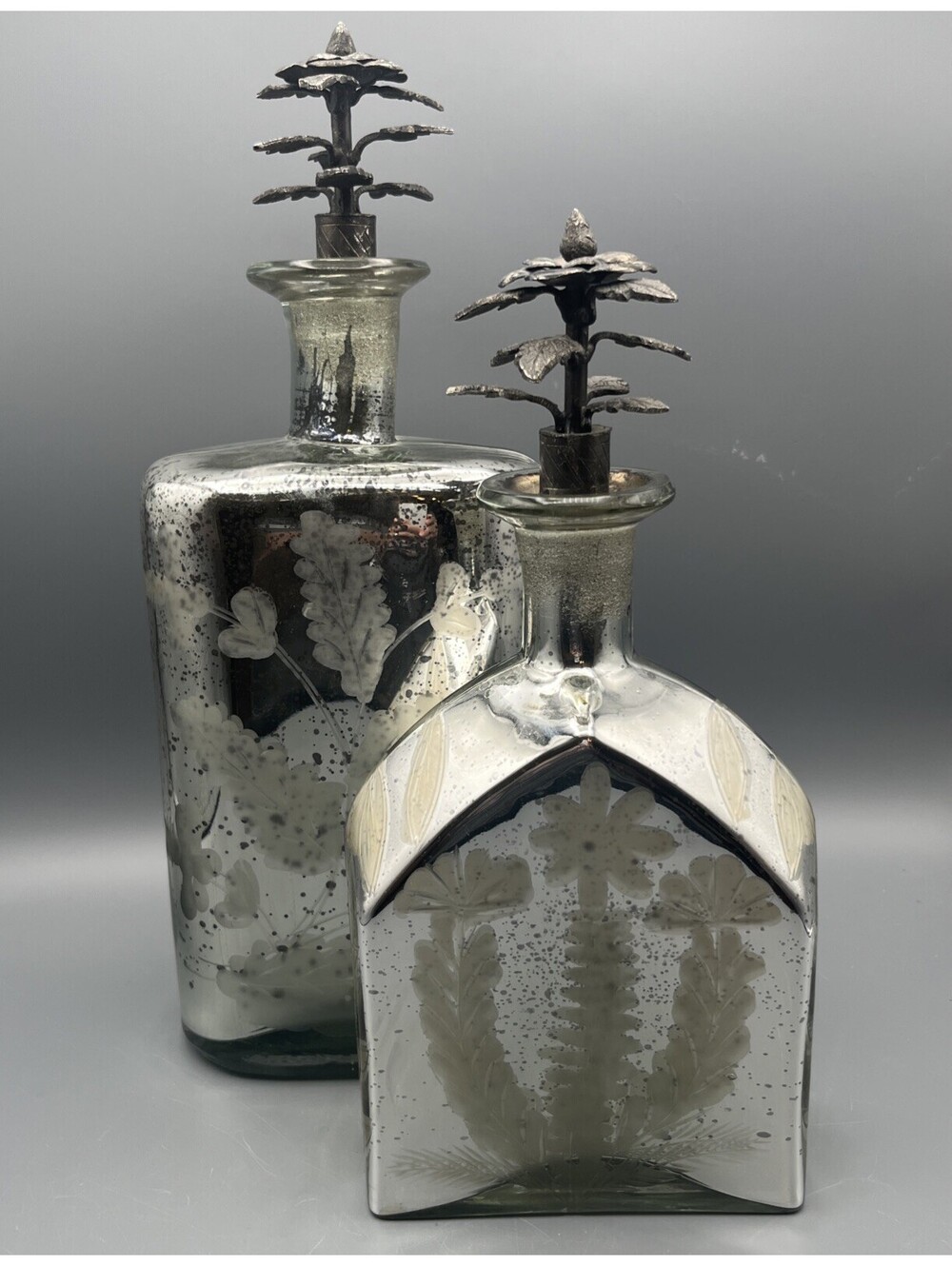 Set 2 Mercury Glass Etched Decorative Bottles 11.5” & 9” Metal Floral Stoppers